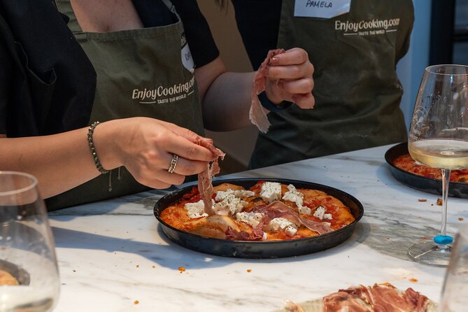 Cook & Dine in Rome: Pizza, Ravioli & Gelato with Unlimited Wine - Making a crisp Roman-style pizza