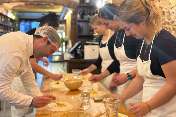 Florence: Pasta & Tiramisu Cooking Class with lots of Good Wine - Rolling pappardelle and cooking the tomato sauce