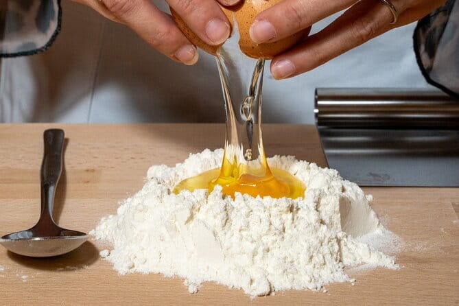 Florence: Pasta & Tiramisu Cooking Class with Unlimited Wine - Making pasta in a Florence restaurant