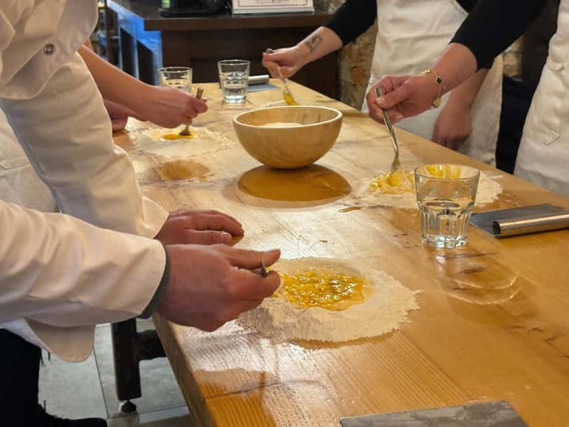 Florence: Premium Pasta Cooking Class with Tiramisu & Wine - Folding spinach and ricotta ravioli by hand