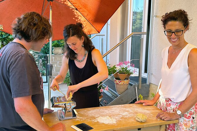 Homemade Italian Lasagna Experience with a Local Family - Layering lasagna with ragù, béchamel, and mascarpone