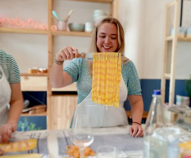 Lazise: Fresh Pasta and Tiramisù Cooking Class at Lake Garda - Sitting down to eat what you made