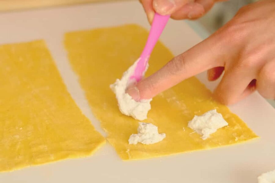 Milan: Fresh Pasta & Tiramisù Class in a Glamorous Home - Filling ravioli and shaping the second pasta
