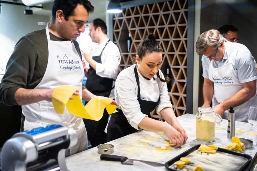 Milan: Pasta Class with Gelato or Tiramisù & Unlimited Wine - Making pasta beside Milan Central Station