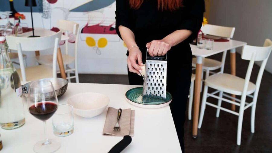 Olbia: cooking class on real pasta carbonara - Sitting down to eat what you made