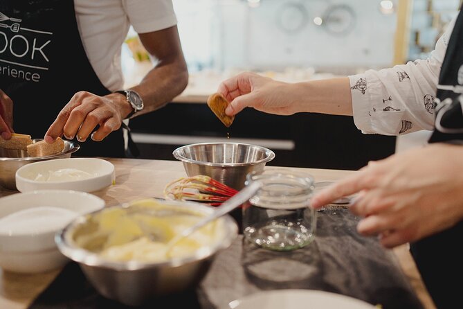 Pasta and Tiramisù Cooking Workshop in the Heart of Rome - Shaping ravioli by hand