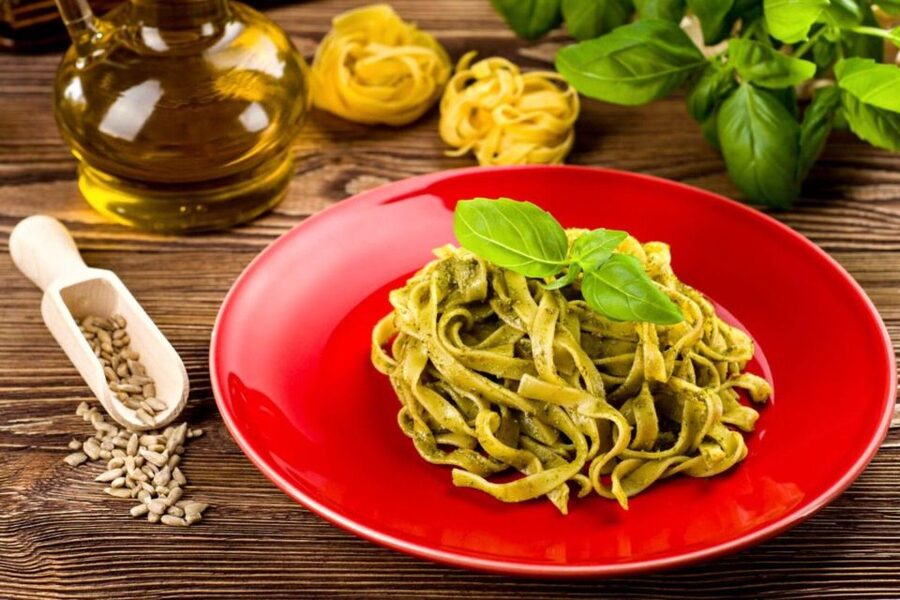 Pasta Cooking Class with Pesto Sauce Making in Rome Center - Crushing basil, cheese, and other pesto ingredients