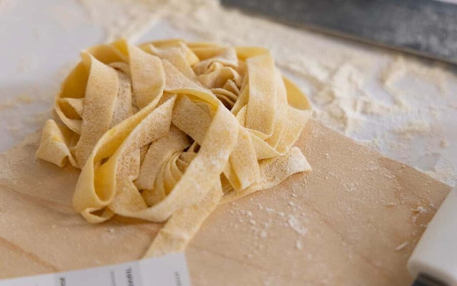 Rome: Enjoy Spritz and Pasta Making in Piazza Navona - Eating your work with tomato sauce and pesto