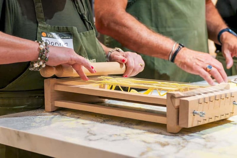 Rome: Hands-On Pasta & Tiramisu Class with Unlimited Wine - Mixing flour and eggs by hand