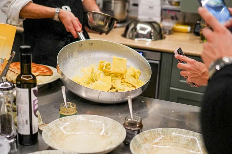 Rome: Hands-On Pasta & Tiramisu Class with Unlimited Wine - Sitting down to eat your own food