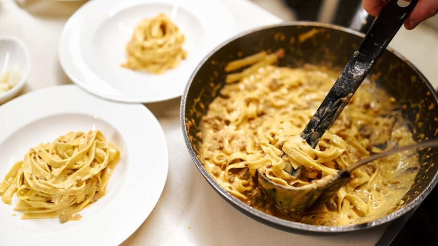 Rome: Pasta and Tiramisu Cooking Class with Prosecco - Rolling fettuccine by hand