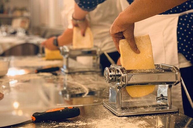 Rome: Pasta Fettuccine Ravioli and Tiramisu Cooking Class - Layering tiramisu for a sweet reward