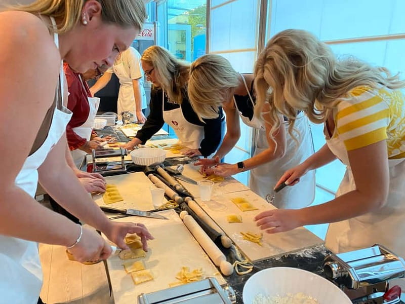 Rome: Pasta, Ravioli & Tiramisu Class with Unlimited Wine - Rolling pasta dough at your own station