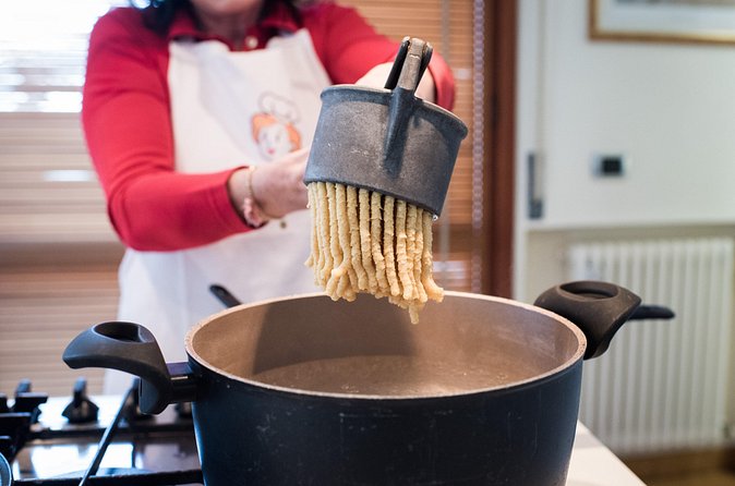 Small group Pasta and Tiramisu class in Rimini - Mixing and kneading the pasta dough