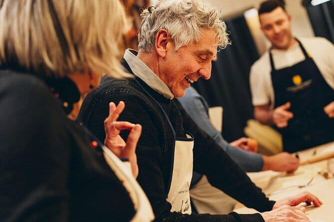 The Art of Pasta and Wine Tasting with Local Sommelier - Rolling pasta with a chef