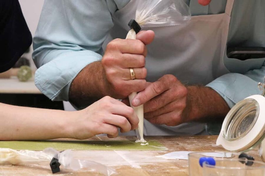 Verona: Authentic Pasta Making Class with a Local Family - Mixing dough and learning the basic cuts